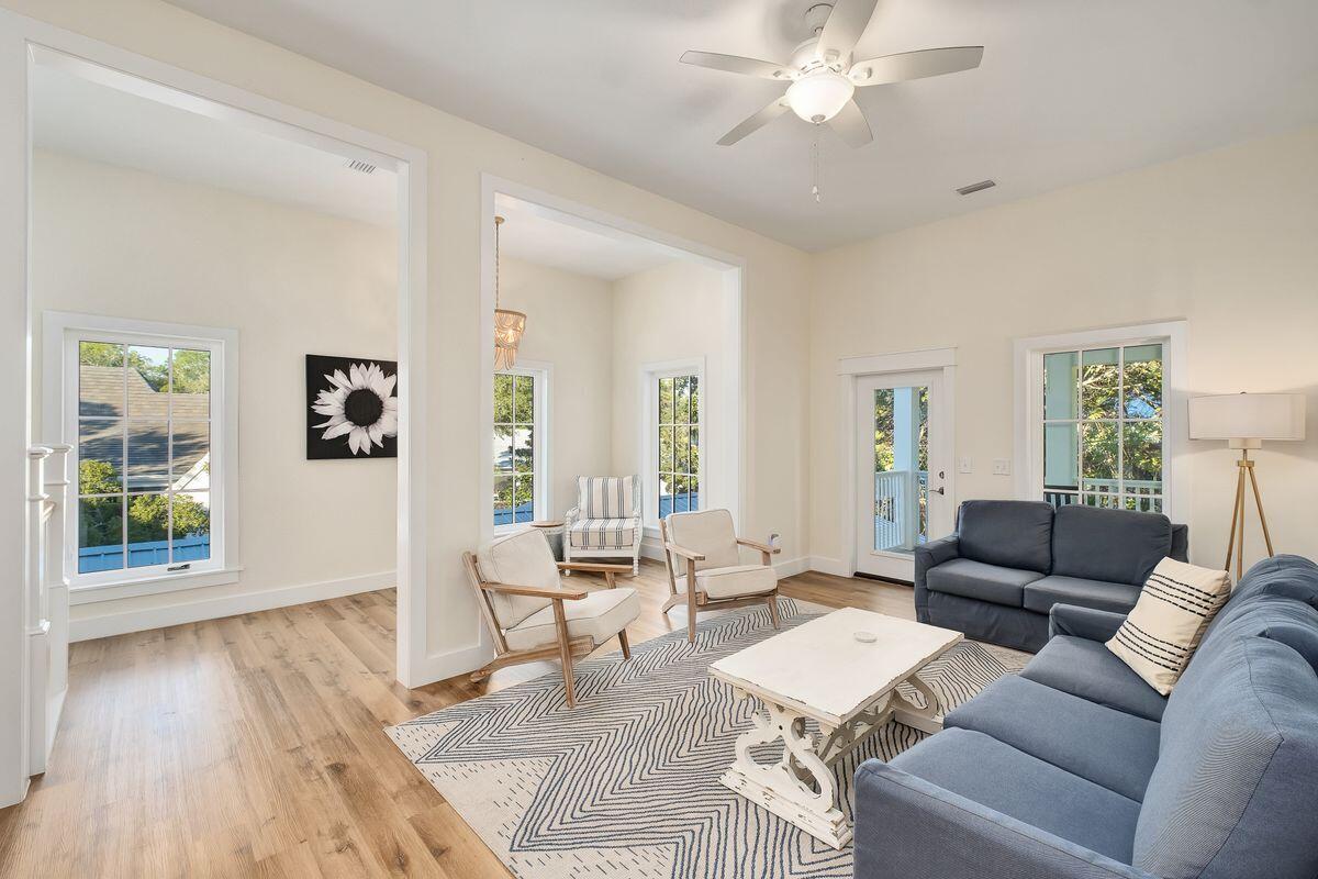 251 Dogwood Street Santa Rosa Beach, FL 32459 - Photo 27 of 51 a living room with furniture and a wooden floor