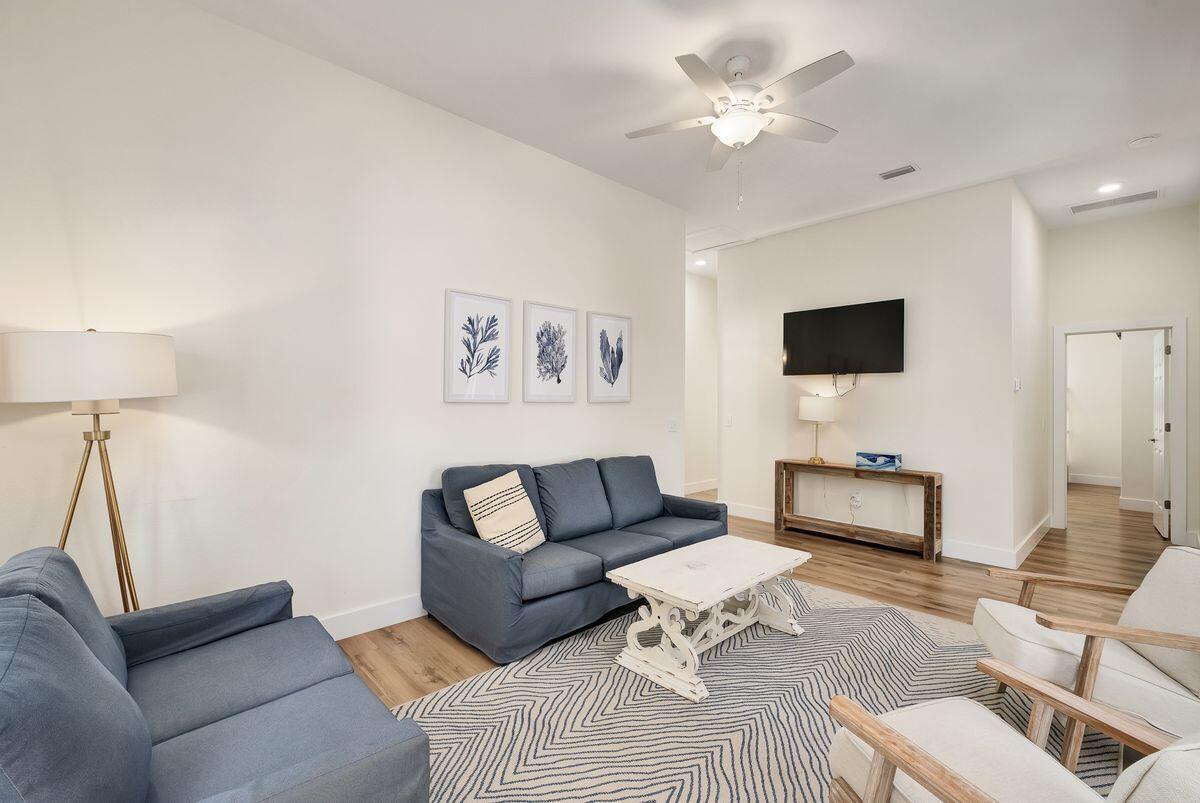 251 Dogwood Street Santa Rosa Beach, FL 32459 - Photo 28 of 51 a living room with furniture and a lamp