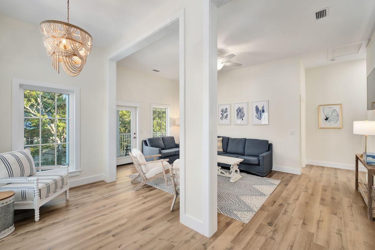 251 Dogwood Street Santa Rosa Beach, FL 32459 - Photo 31 of 51 a living room with furniture and a wooden floor