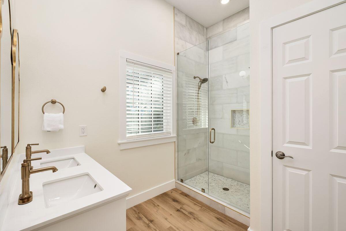 251 Dogwood Street Santa Rosa Beach, FL 32459 - Photo 33 of 51 a bathroom with a sink a toilet and shower
