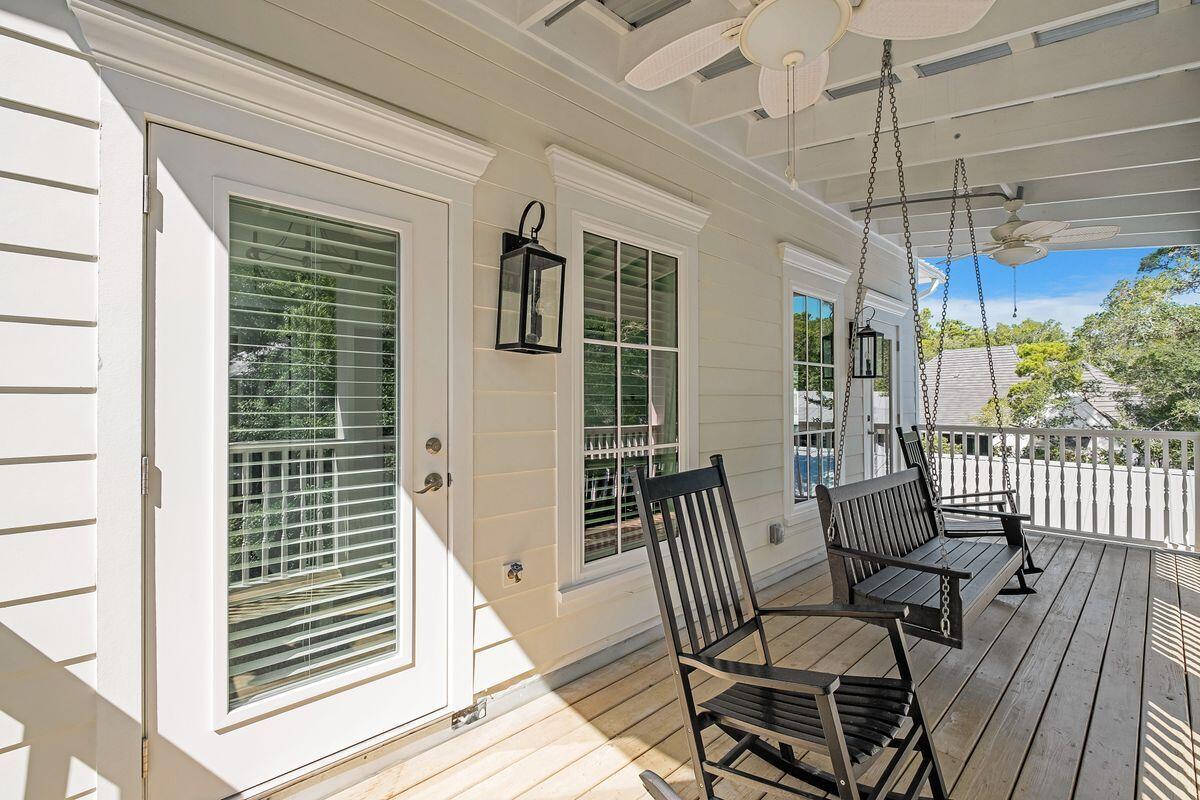 251 Dogwood Street Santa Rosa Beach, FL 32459 - Photo 35 of 51 a view of a chair and tables in the balcony