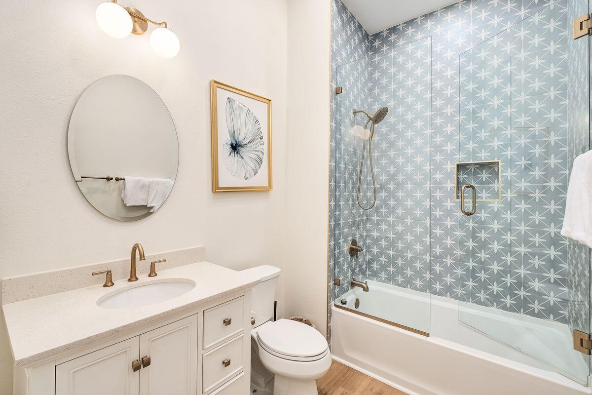 251 Dogwood Street Santa Rosa Beach, FL 32459 - Photo 37 of 51 a bathroom with a sink a toilet and a mirror