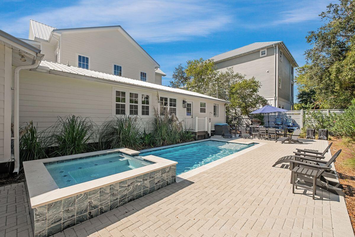 251 Dogwood Street Santa Rosa Beach, FL 32459 - Photo 5 of 51 a view of a house with backyard and sitting area