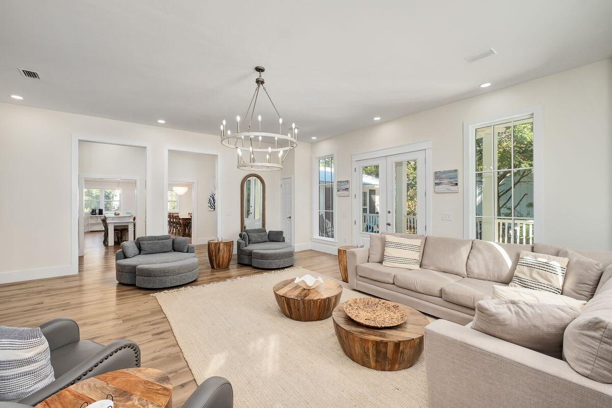 251 Dogwood Street Santa Rosa Beach, FL 32459 - Photo 10 of 51 a living room with furniture and a chandelier