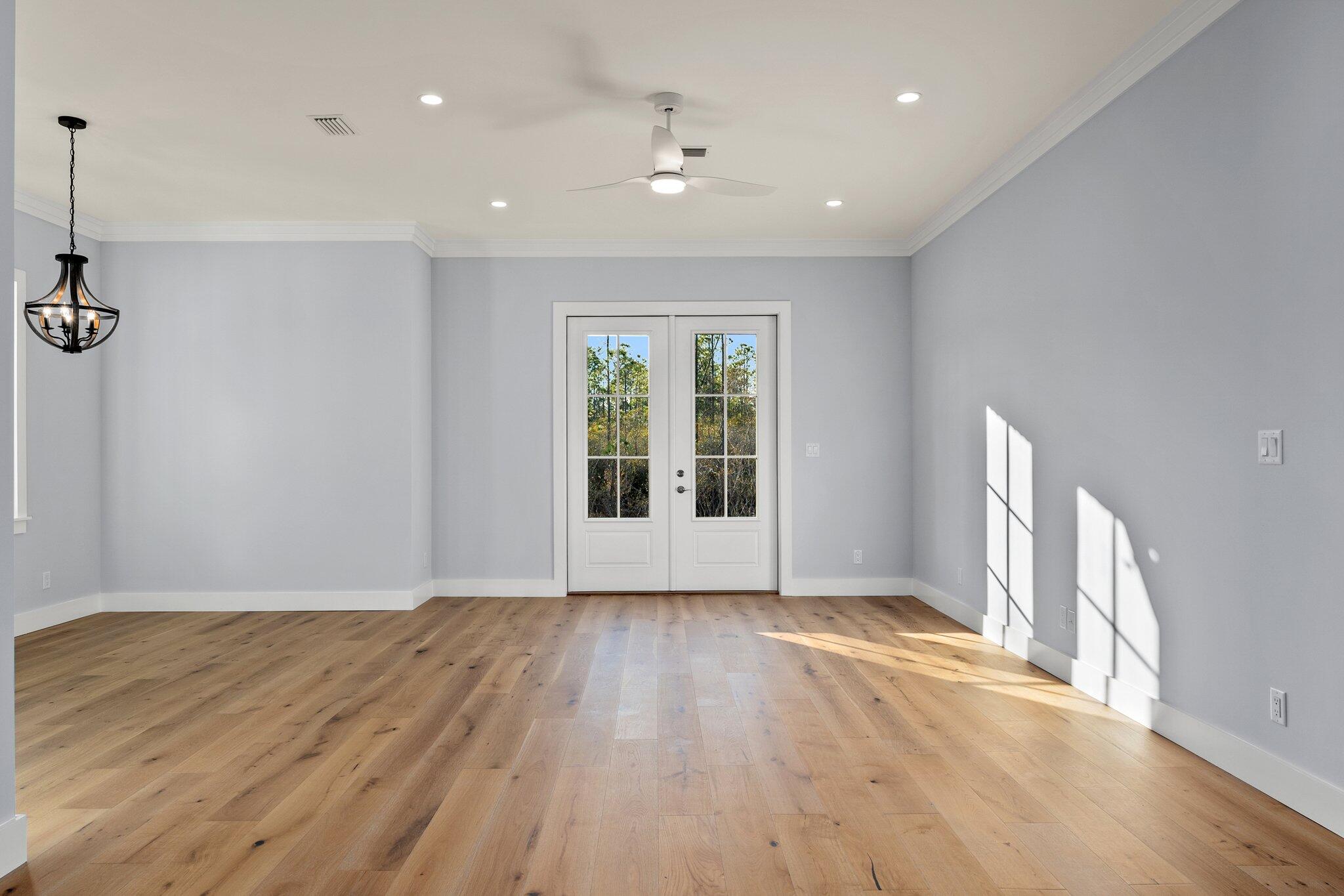 50 Cord Road Santa Rosa Beach, FL 32459 - Photo 12 of 73 a view of an empty room with wooden floor and a window
