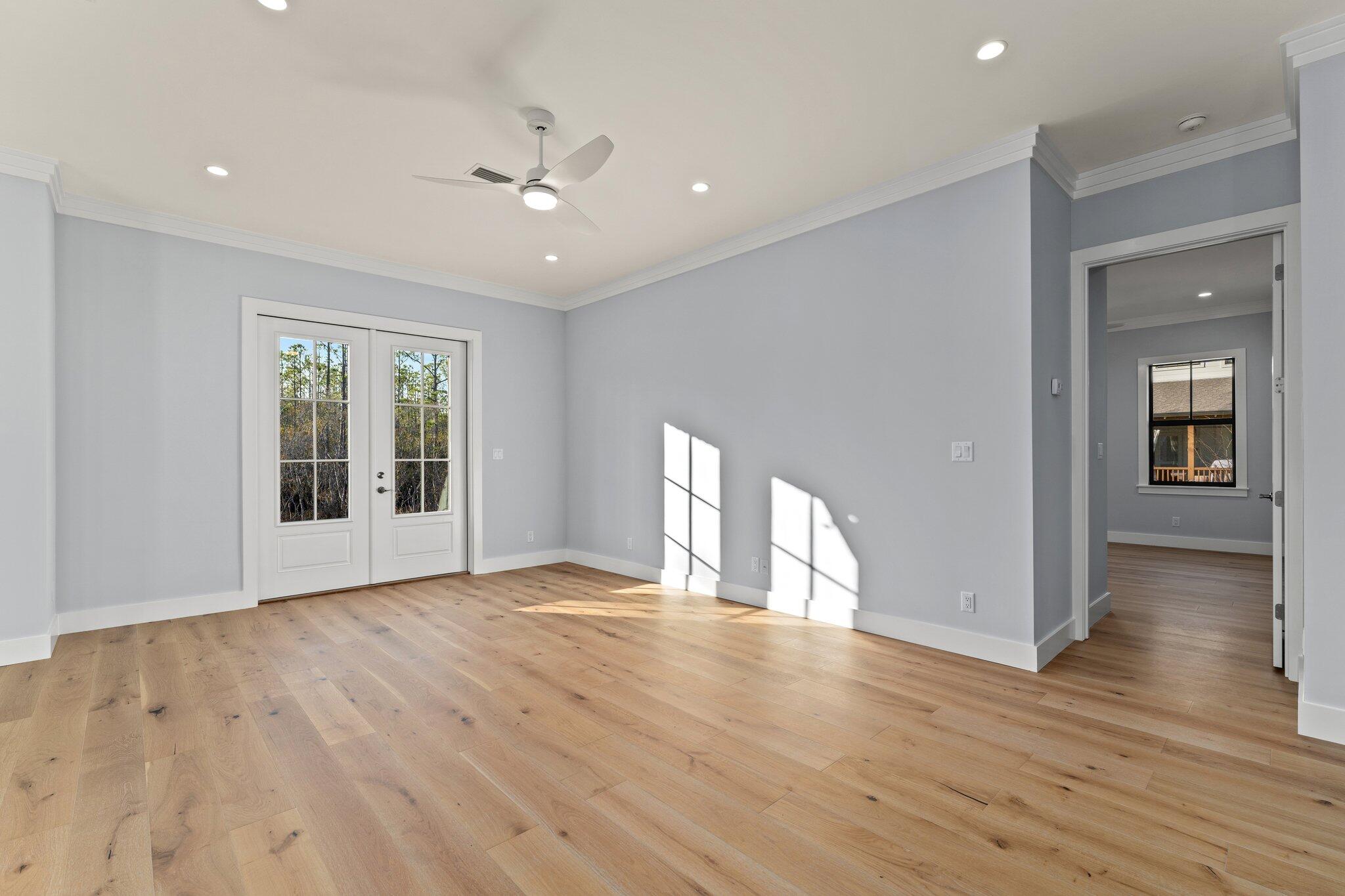 50 Cord Road Santa Rosa Beach, FL 32459 - Photo 13 of 73 a view of an empty room with wooden floor and a window