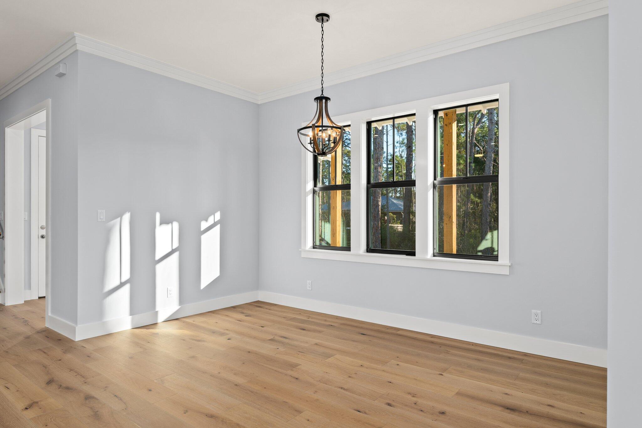 50 Cord Road Santa Rosa Beach, FL 32459 - Photo 15 of 73 a view of an empty room with wooden floor and a window
