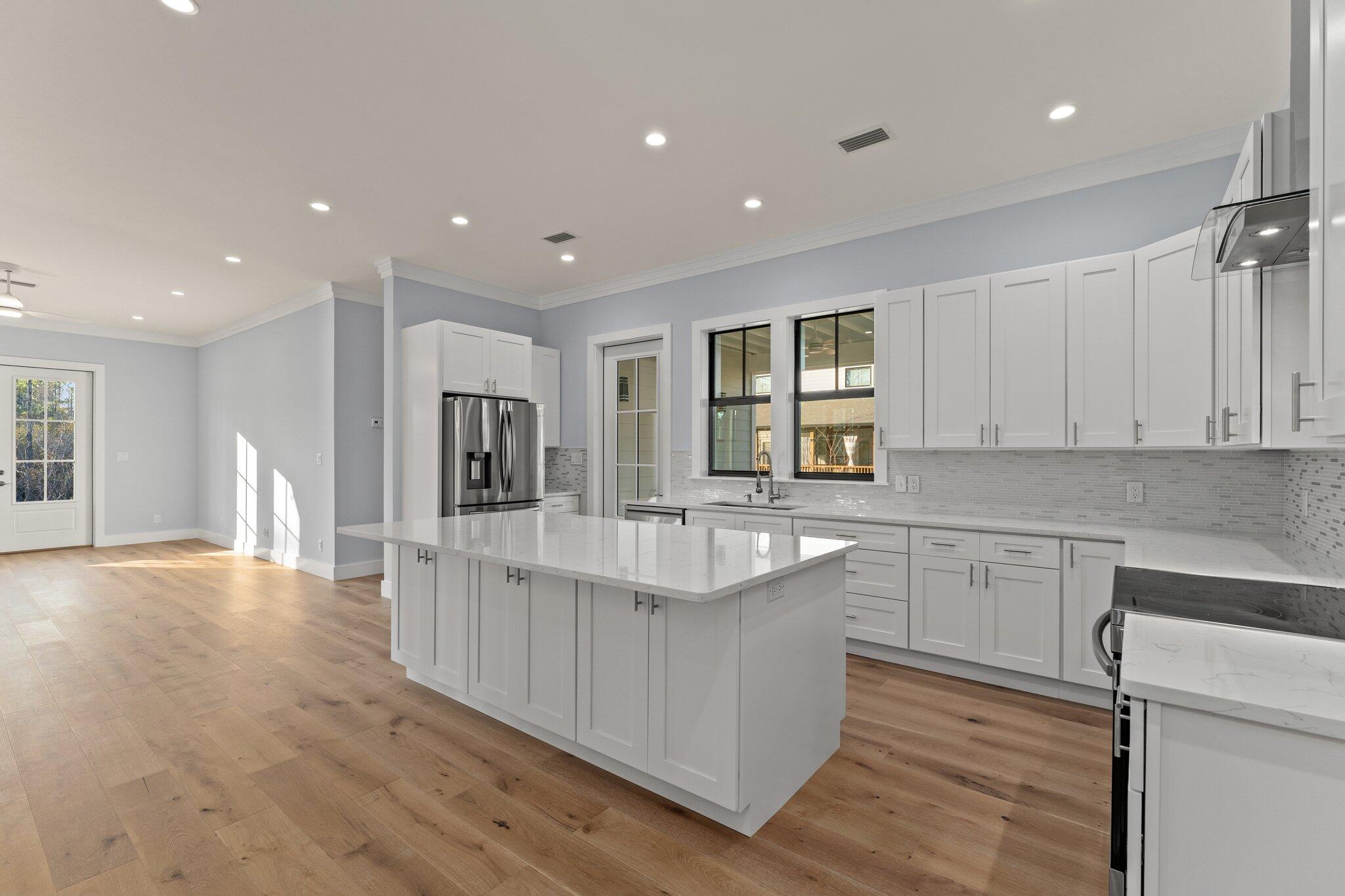 50 Cord Road Santa Rosa Beach, FL 32459 - Photo 20 of 73 a kitchen with stainless steel appliances granite countertop a sink stove and refrigerator