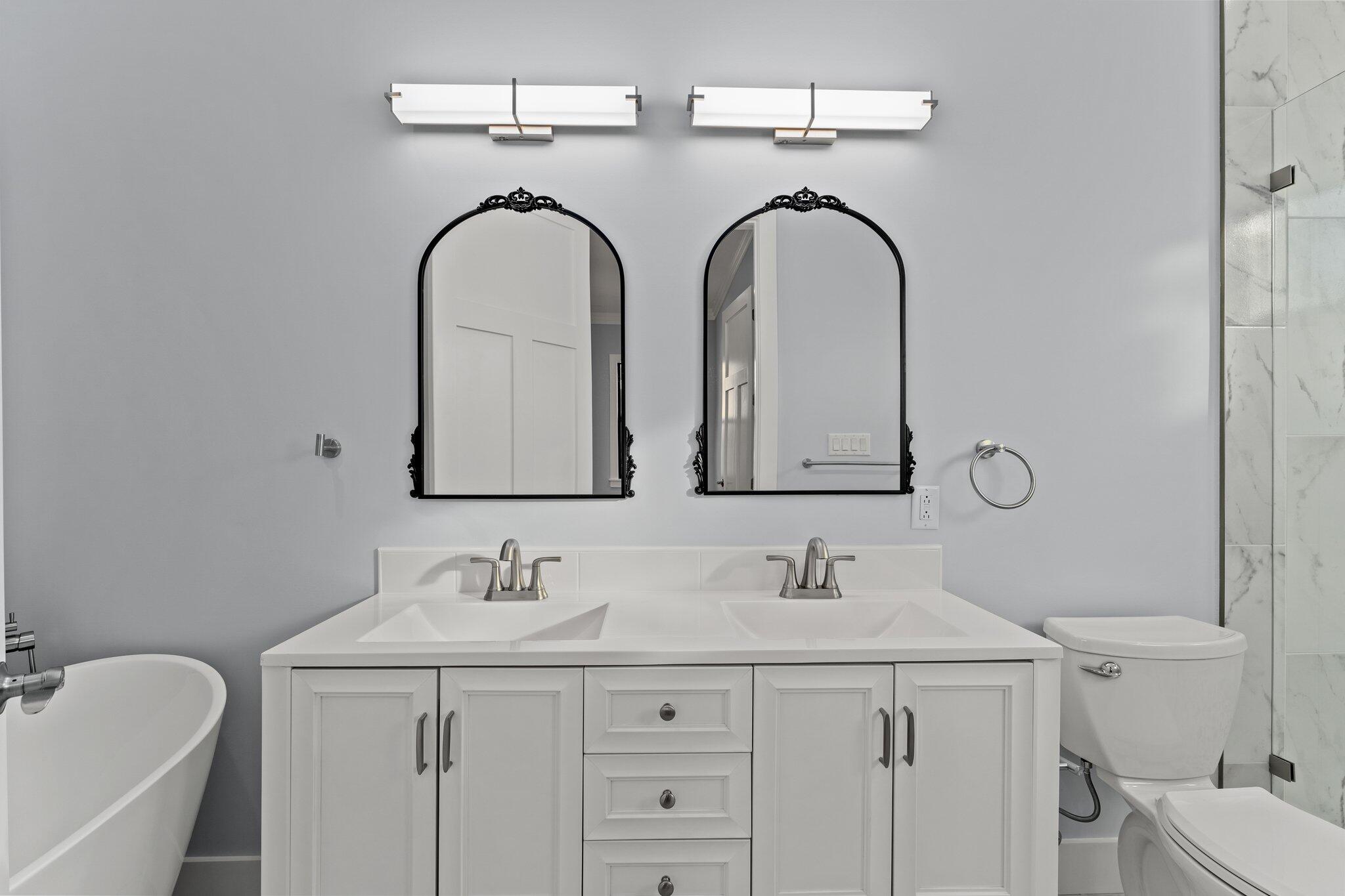 50 Cord Road Santa Rosa Beach, FL 32459 - Photo 26 of 73 a bathroom with a granite countertop sink a toilet and a mirror