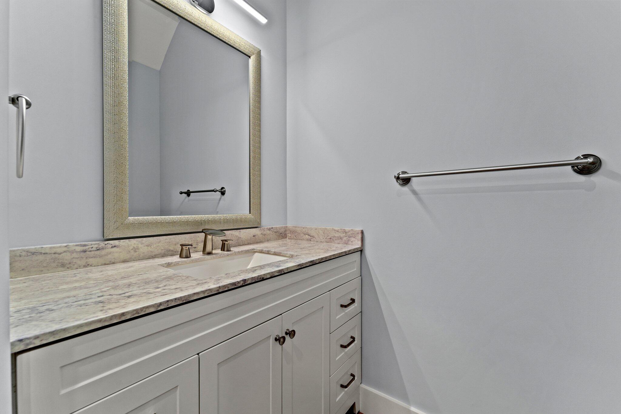50 Cord Road Santa Rosa Beach, FL 32459 - Photo 30 of 73 a bathroom with a granite countertop sink and a mirror