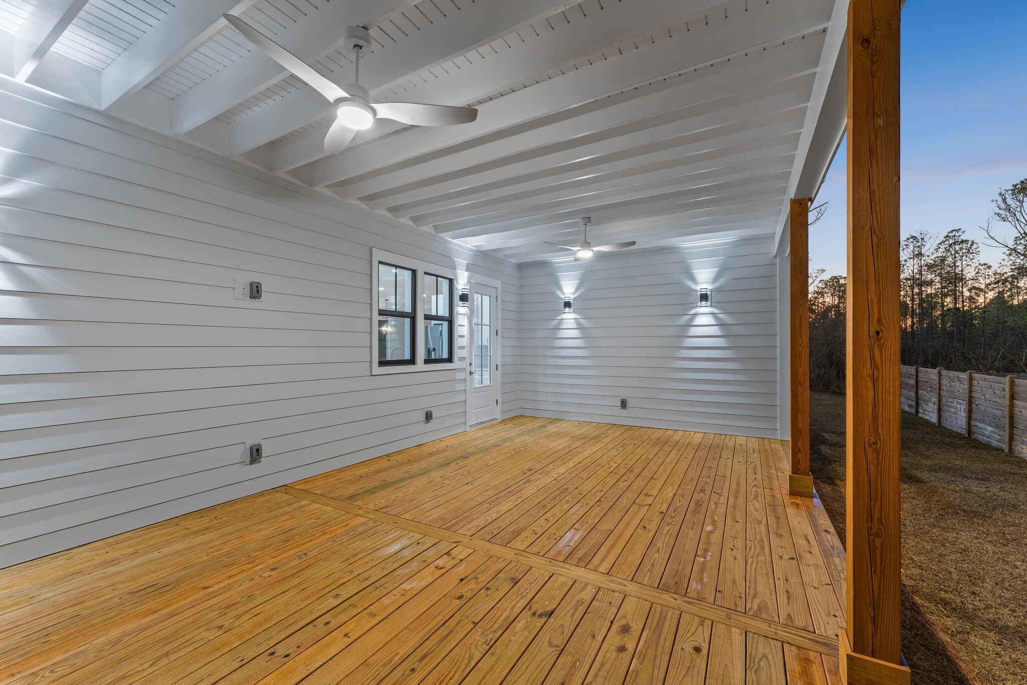 50 Cord Road Santa Rosa Beach, FL 32459 - Photo 34 of 73 a view of an empty room with wooden floor and a window