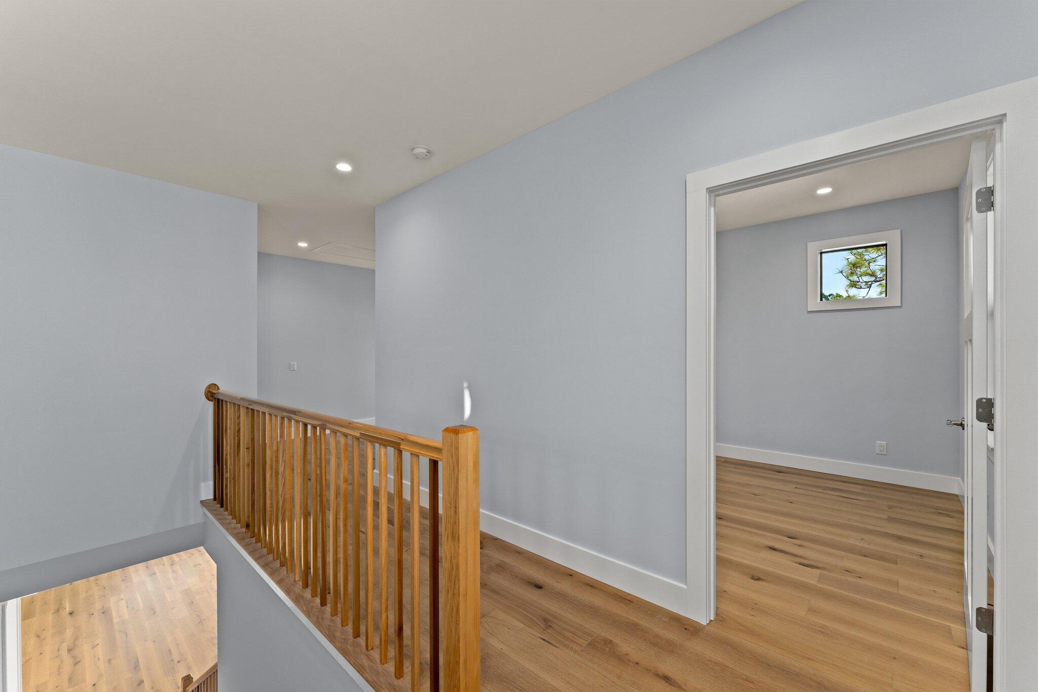 50 Cord Road Santa Rosa Beach, FL 32459 - Photo 38 of 73 a view of a hallway with wooden floor