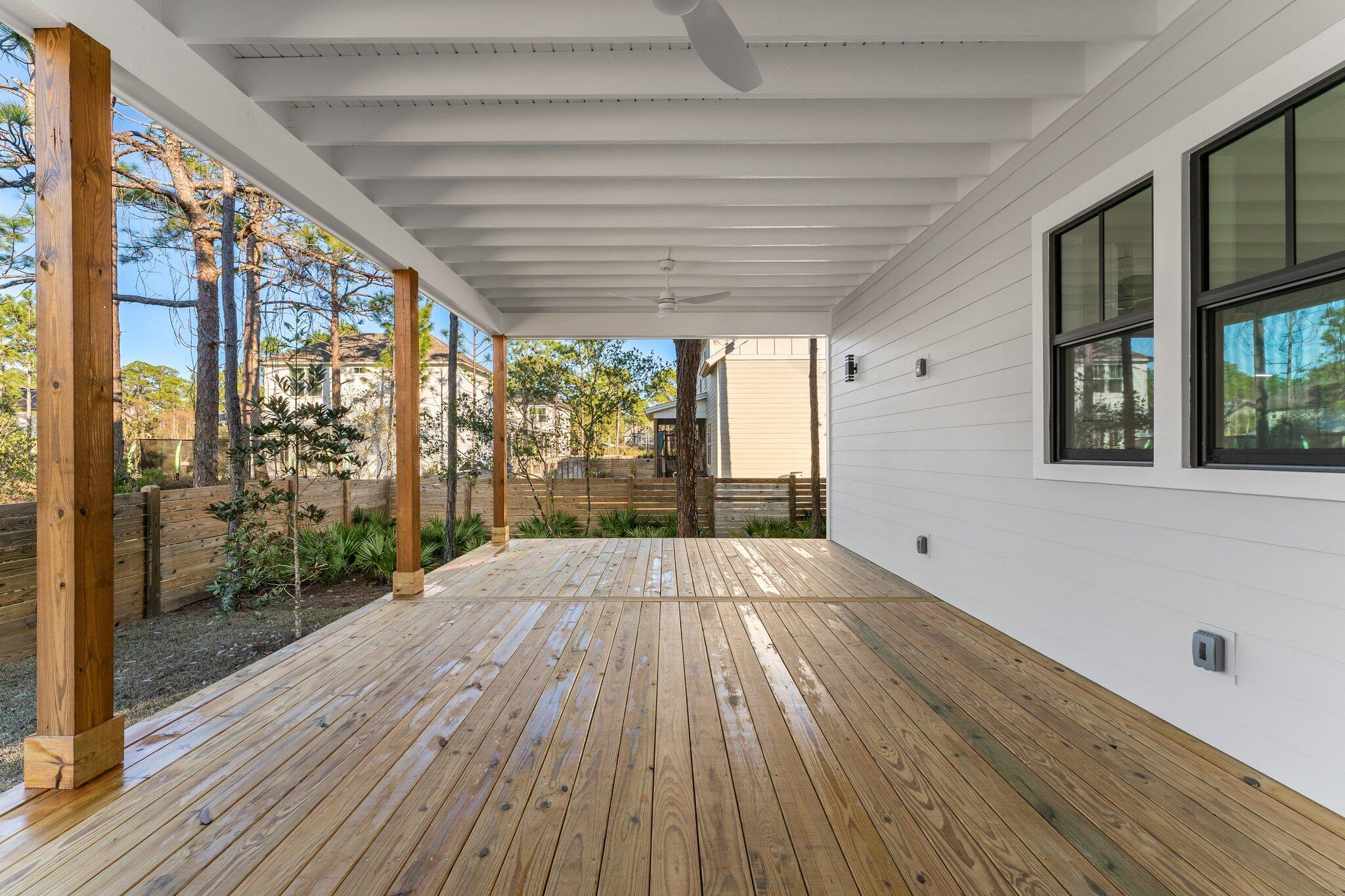 50 Cord Road Santa Rosa Beach, FL 32459 - Photo 54 of 73 a view of backyard with a large window and wooden floor