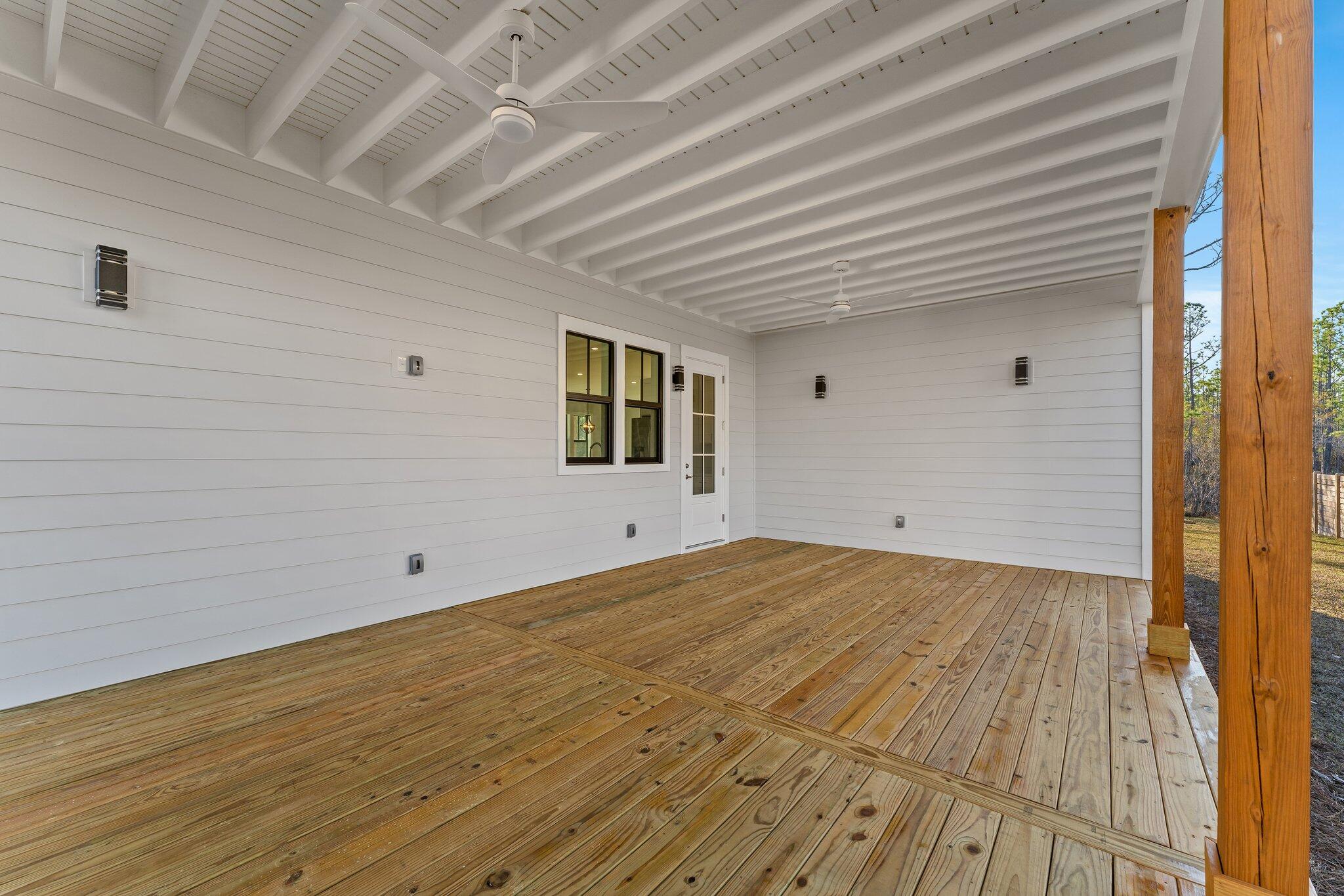 50 Cord Road Santa Rosa Beach, FL 32459 - Photo 55 of 73 a view of an empty room with wooden floor and a window