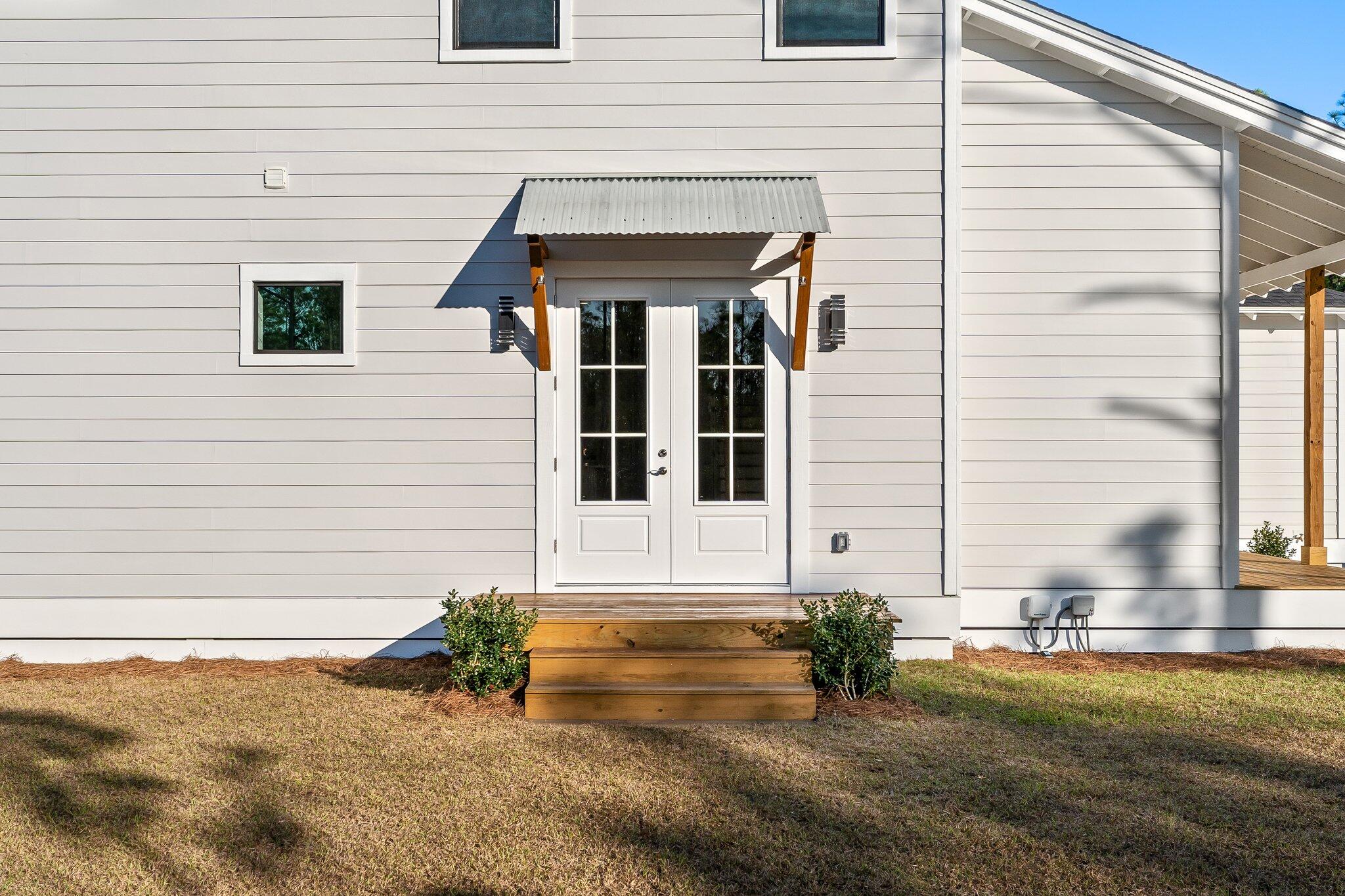 50 Cord Road Santa Rosa Beach, FL 32459 - Photo 58 of 73 a view of a brick house with potted plants