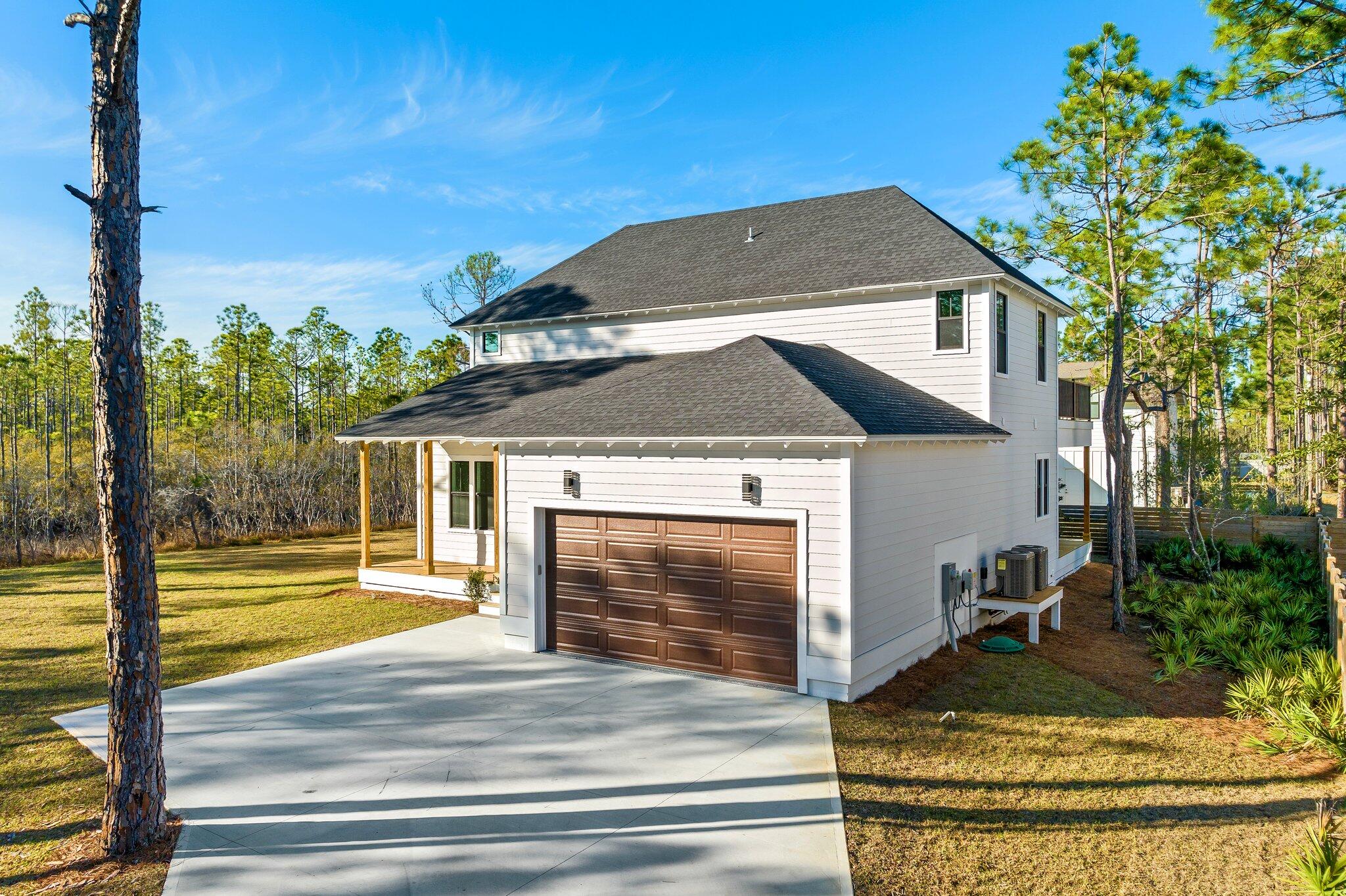 50 Cord Road Santa Rosa Beach, FL 32459 - Photo 59 of 73 a front view of a house with garden