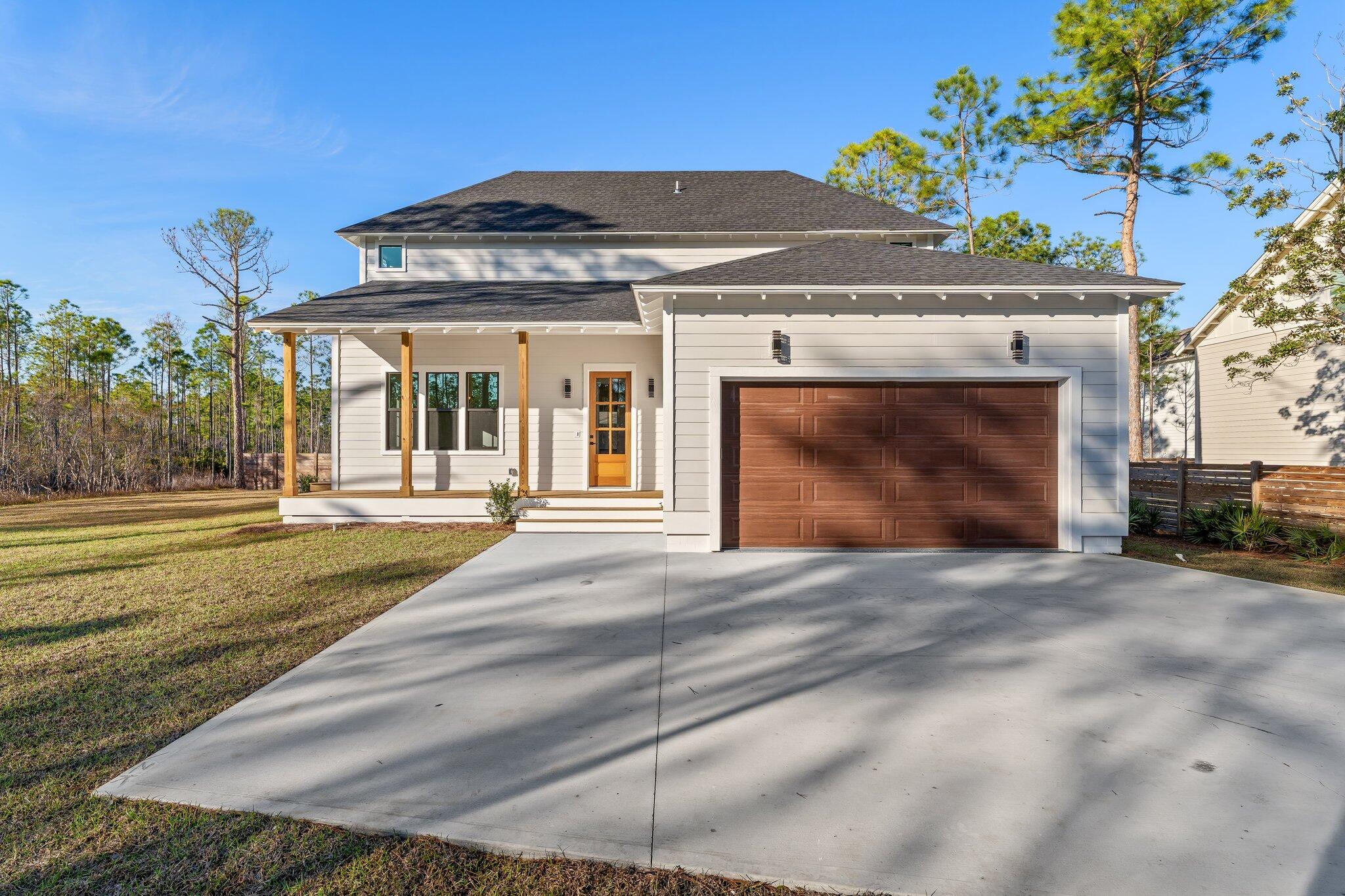 50 Cord Road Santa Rosa Beach, FL 32459 - Photo 61 of 73 a front view of a house with a yard