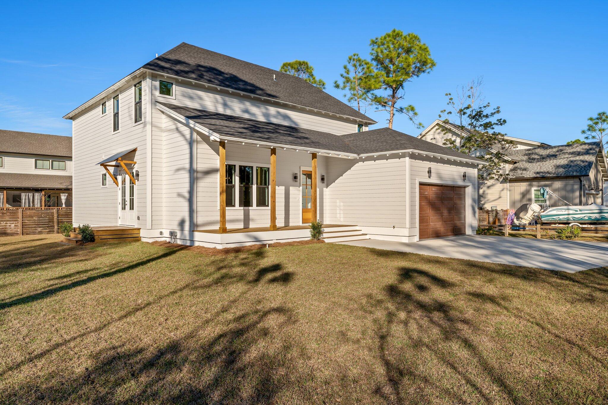 50 Cord Road Santa Rosa Beach, FL 32459 - Photo 62 of 73 a view of a white house with a outdoor space