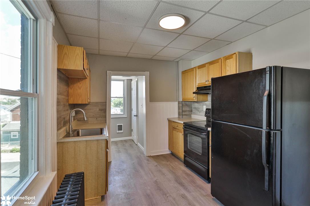 619 Sioux Street Bethlehem, PA 18015 - Photo 18 of 61 a kitchen with a refrigerator and a sink