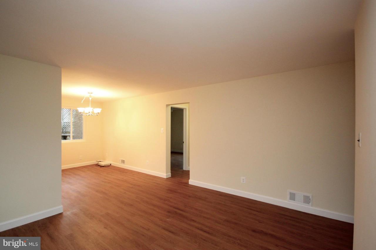 1901 North Quebec Street, Unit MIDDLE Arlington, VA 22207 - Photo 6 of 21 a view of empty room with wooden floor