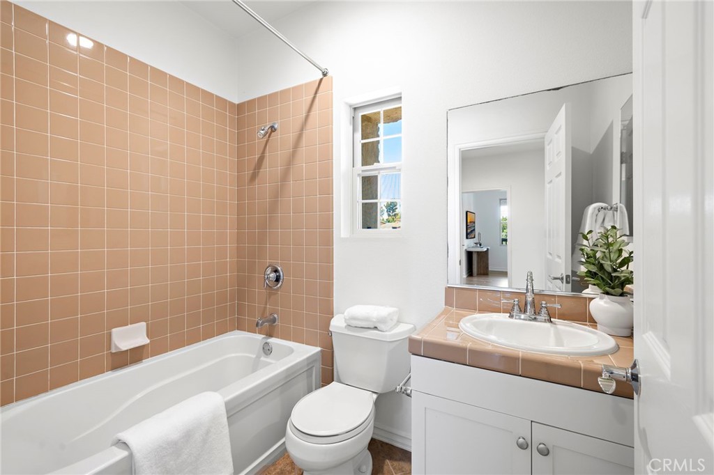 47 Tuscany Ladera Ranch, CA 92694 - Photo 21 of 28 a bathroom with a sink a toilet and shower