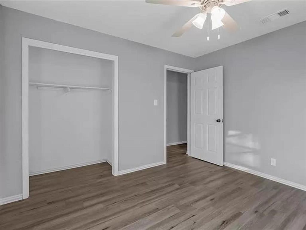 732 East Morton Street Denison, TX 75021 - Photo 11 of 14 a view of an empty room with wooden floor