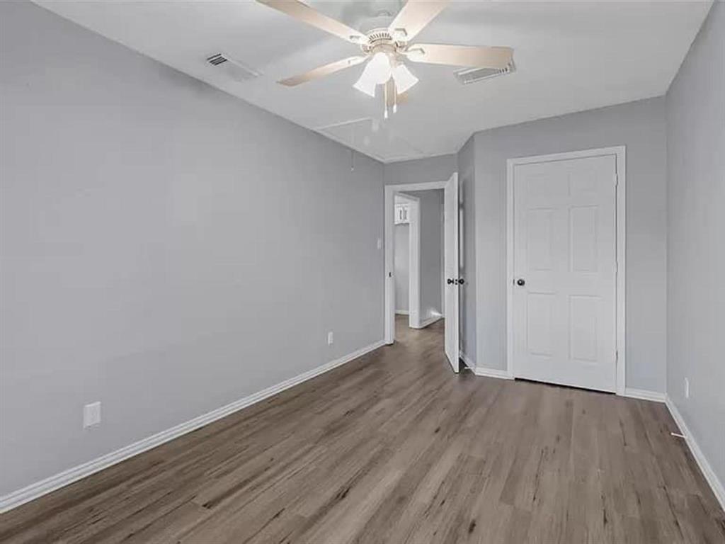732 East Morton Street Denison, TX 75021 - Photo 9 of 14 a view of an empty room with wooden floor
