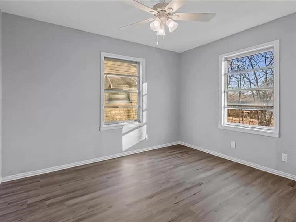 732 East Morton Street Denison, TX 75021 - Photo 10 of 14 a view of an empty room with wooden floor and a window