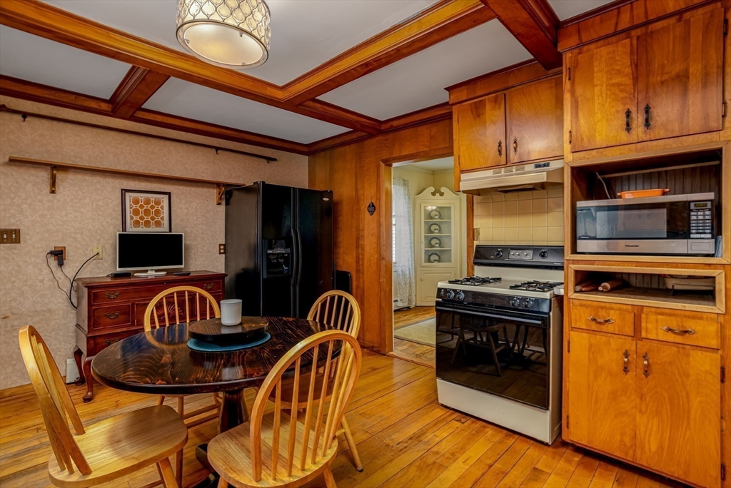 216 Dunstable Road North Chelmsford, MA 01863 - Photo 11 of 42 a kitchen with granite countertop a stove a sink and a refrigerator
