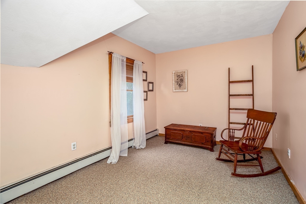 216 Dunstable Road North Chelmsford, MA 01863 - Photo 17 of 42 a livingroom with furniture and white walls