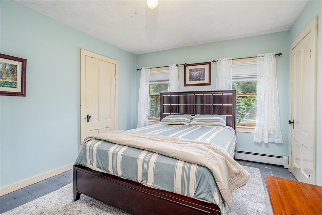 216 Dunstable Road North Chelmsford, MA 01863 - Photo 20 of 42 a bedroom with a bed and a window