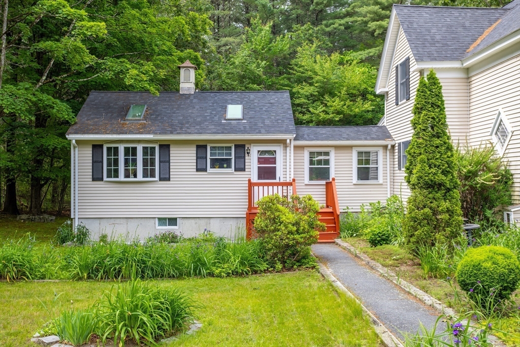 216 Dunstable Road North Chelmsford, MA 01863 - Photo 3 of 42 a aerial view of a house with a yard and plants