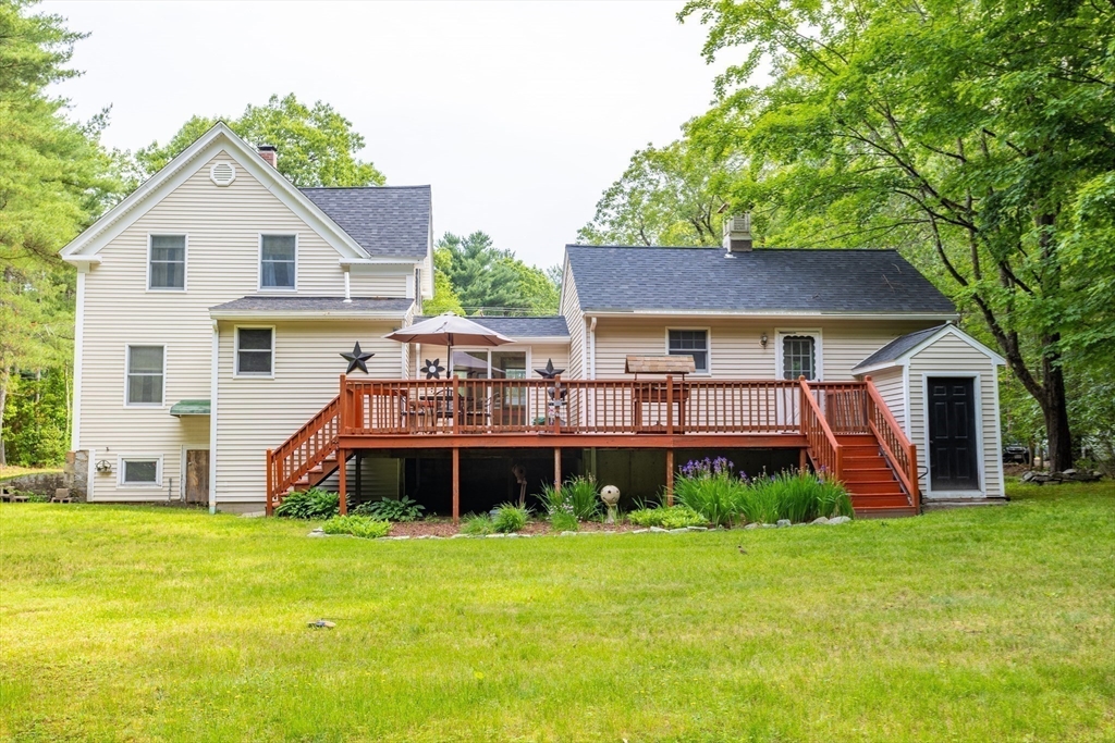 216 Dunstable Road North Chelmsford, MA 01863 - Photo 35 of 42 a front view of a house with garden