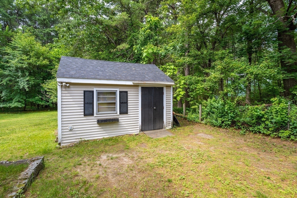 216 Dunstable Road North Chelmsford, MA 01863 - Photo 39 of 42 a front view of a house with garden