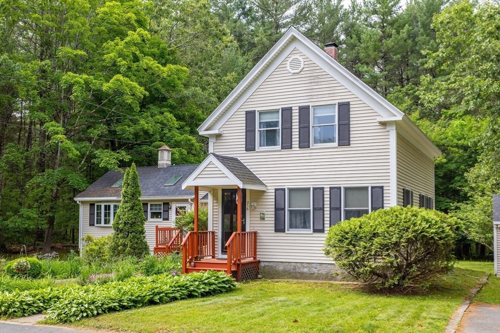 216 Dunstable Road North Chelmsford, MA 01863 - Photo 4 of 42 a front view of a house with garden