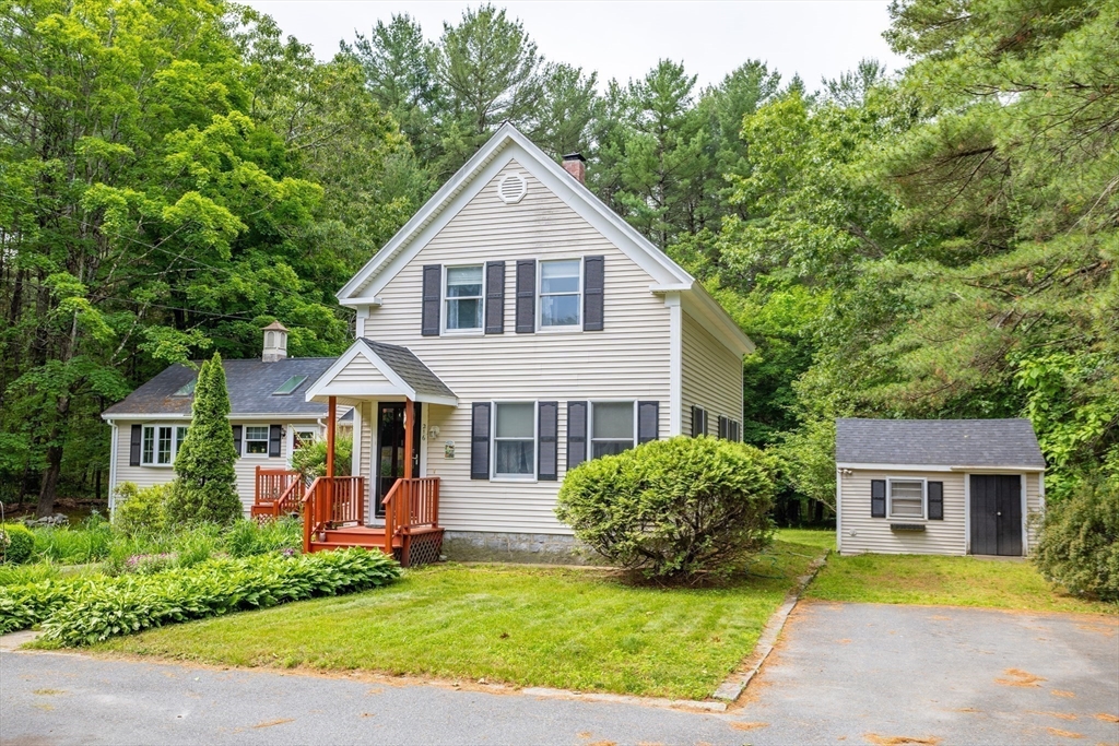 216 Dunstable Road North Chelmsford, MA 01863 - Photo 6 of 42 a view of a house with a yard