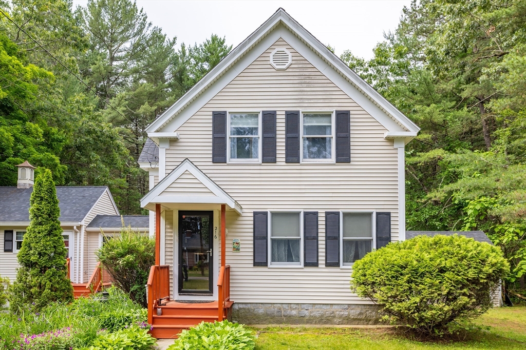 216 Dunstable Road North Chelmsford, MA 01863 - Photo 7 of 42 a front view of a house with garden
