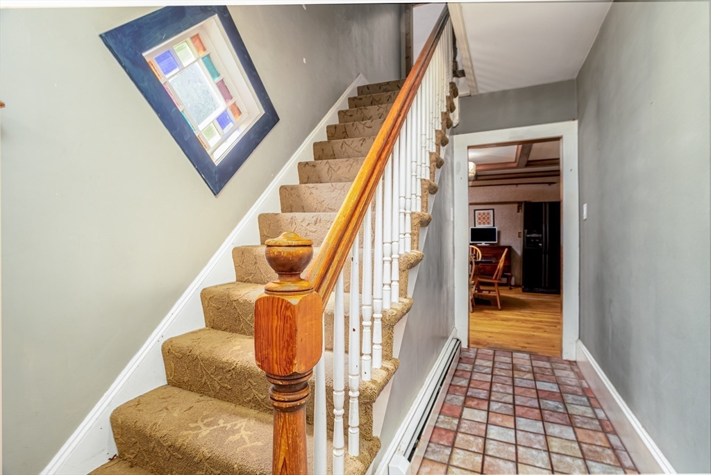 216 Dunstable Road North Chelmsford, MA 01863 - Photo 8 of 42 a hallway with a furniture
