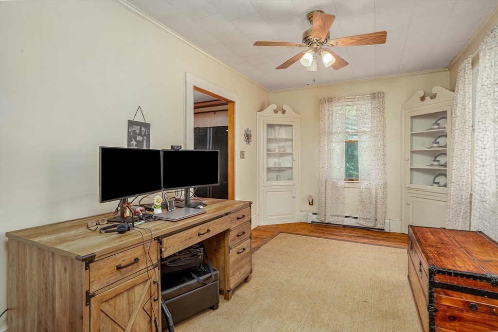 216 Dunstable Road North Chelmsford, MA 01863 - Photo 10 of 42 a bedroom with a bed and a chandelier