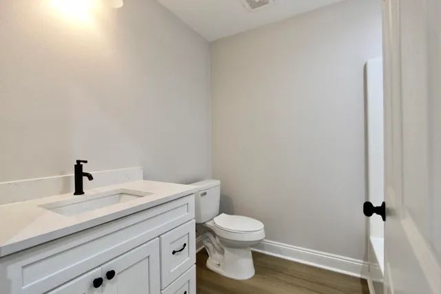 a bathroom with a toilet and a sink