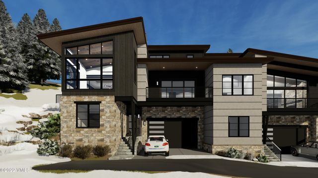 a front view of a house with a garage