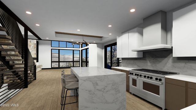a kitchen with stainless steel appliances granite countertop a stove and a refrigerator