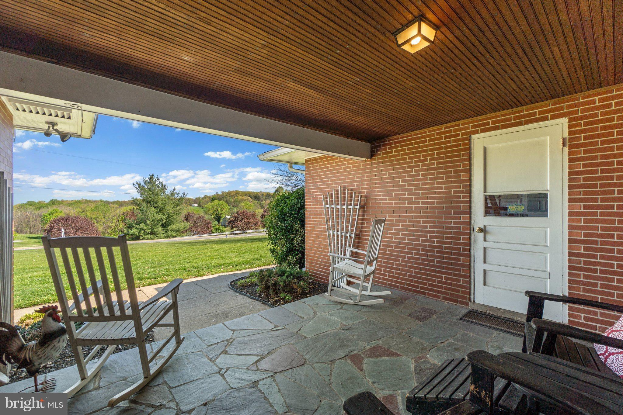14958 New Windsor Road New Windsor, MD 21776 - Photo 32 of 38 Covered Porch/Enclosed Breezeway