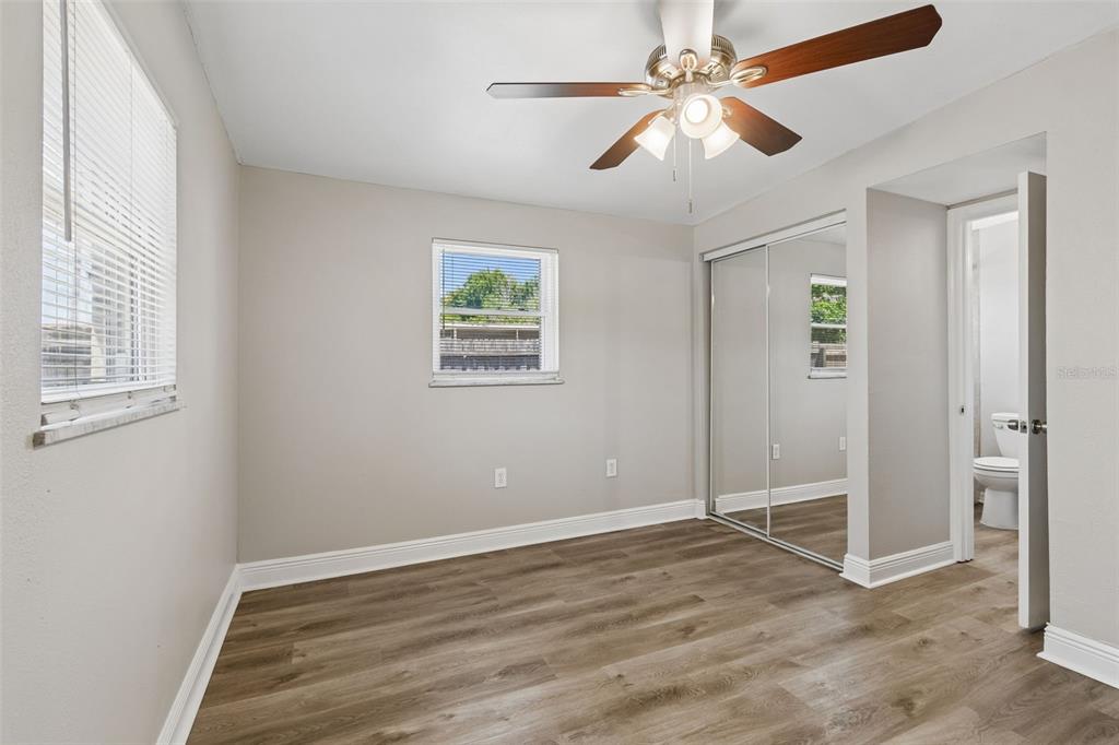 9228 82nd Way Seminole, FL 33777 - Photo 22 of 35 wooden floor in an empty room with a window
