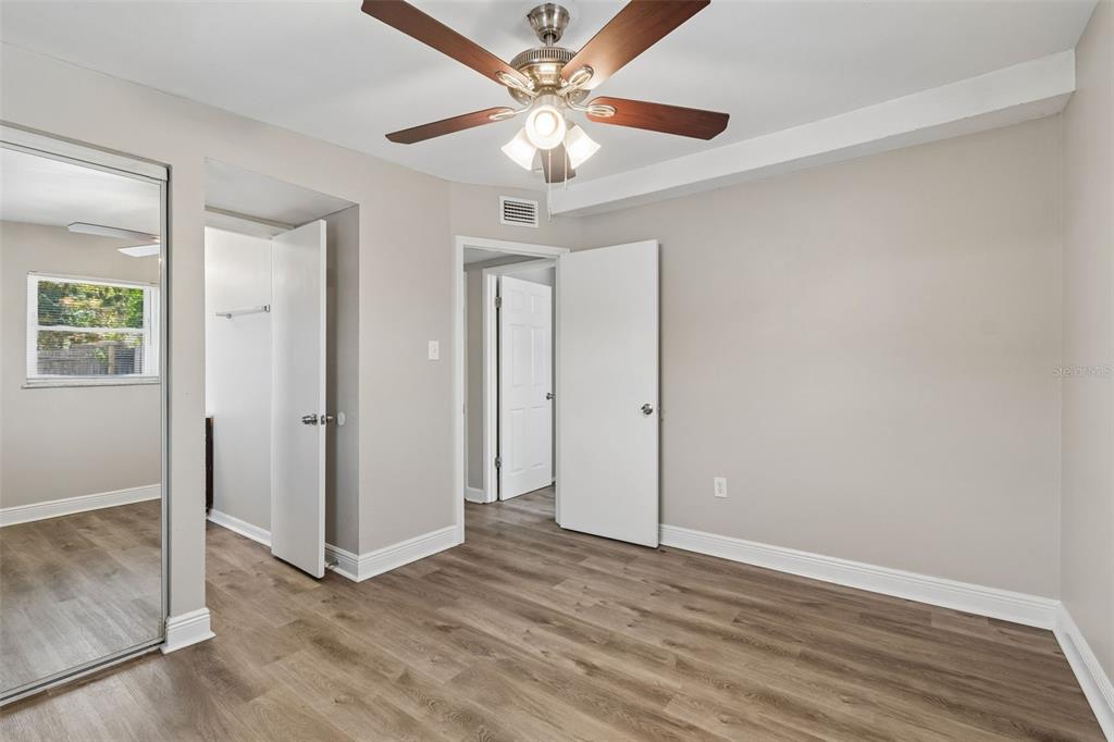 9228 82nd Way Seminole, FL 33777 - Photo 23 of 35 wooden floor in an empty room with a window
