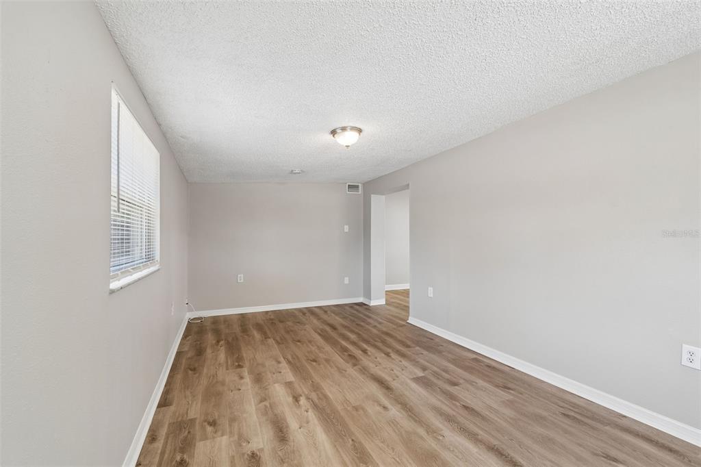 9228 82nd Way Seminole, FL 33777 - Photo 26 of 35 a view of a room with wooden floor and windows