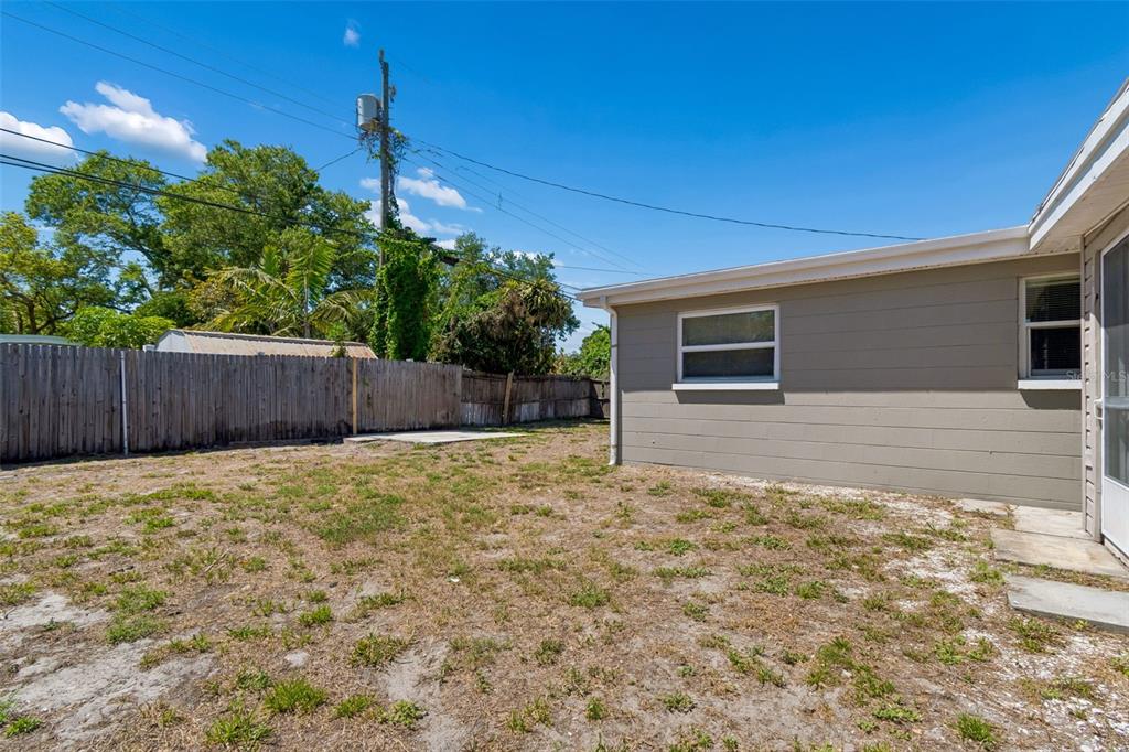 9228 82nd Way Seminole, FL 33777 - Photo 28 of 35 a backyard of a house with lots of green space