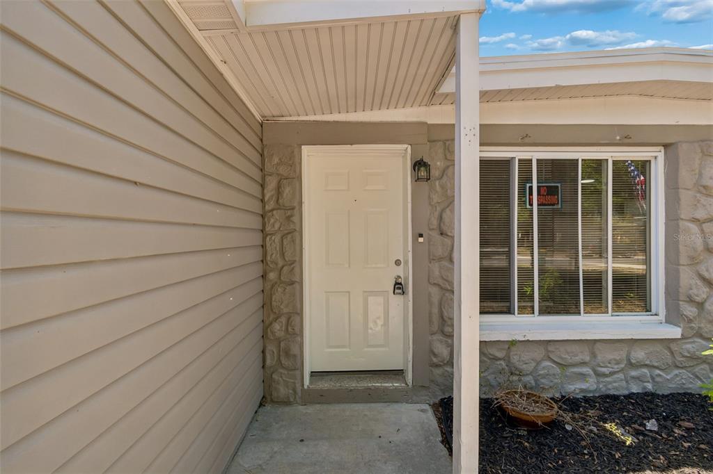 9228 82nd Way Seminole, FL 33777 - Photo 4 of 35 a view of front door of house