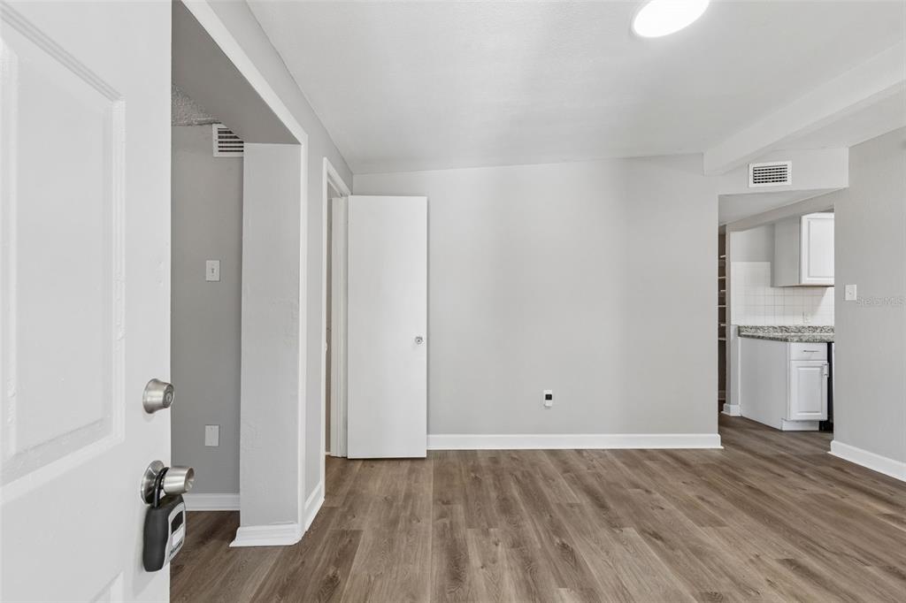 9228 82nd Way Seminole, FL 33777 - Photo 5 of 35 a view of empty room with wooden floor and fan