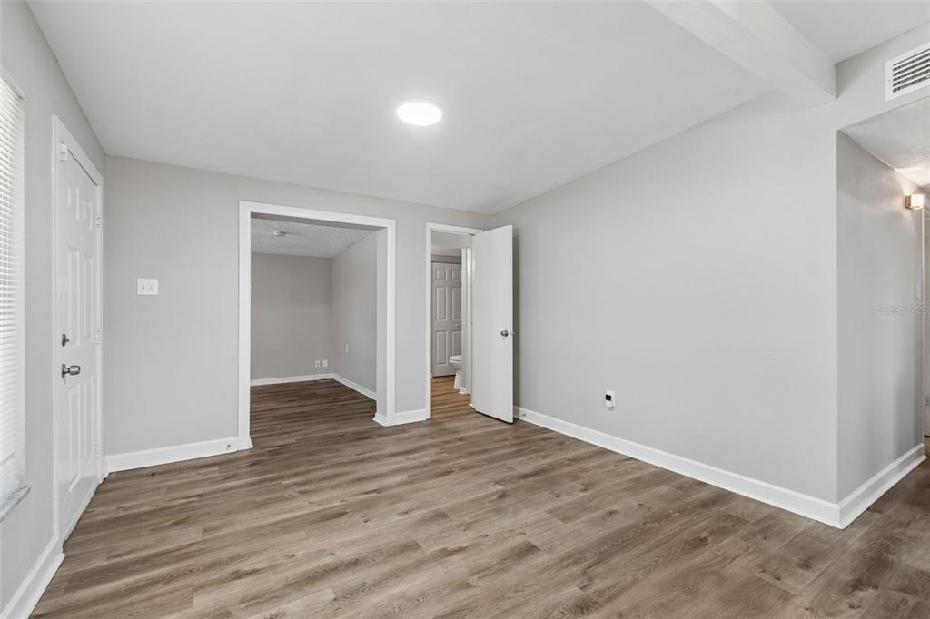 9228 82nd Way Seminole, FL 33777 - Photo 8 of 35 a view of an empty room with wooden floor